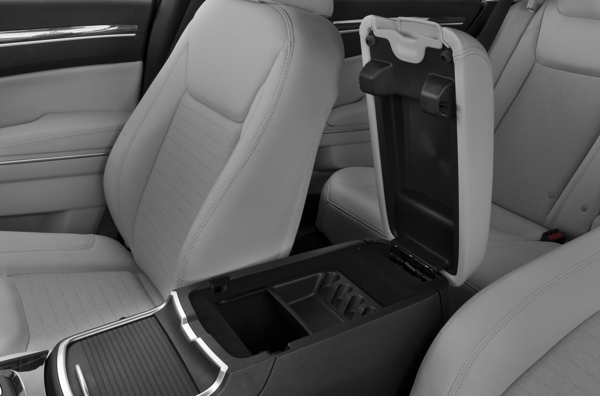 Open armrest storage console between two front car seats