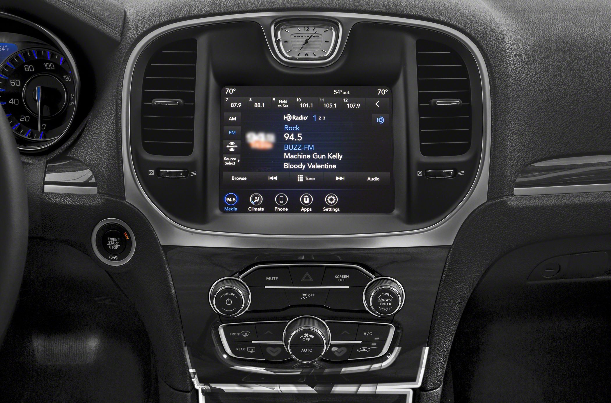 Infotainment touchscreen with climate and audio controls on car dashboard