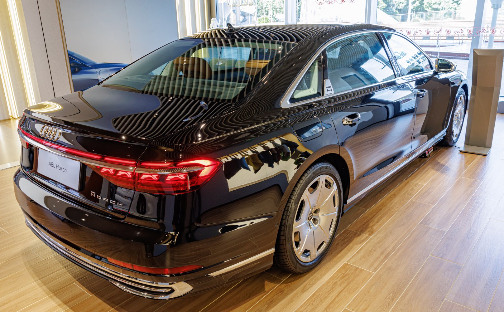 Luxury sedan rear view with LED taillights and elegant wheel design