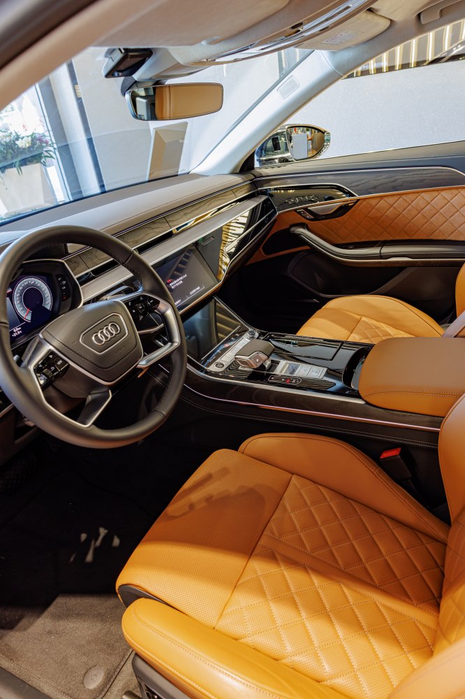 Diamond-stitched leather seats and advanced glossy black dashboard with touchscreen displays.