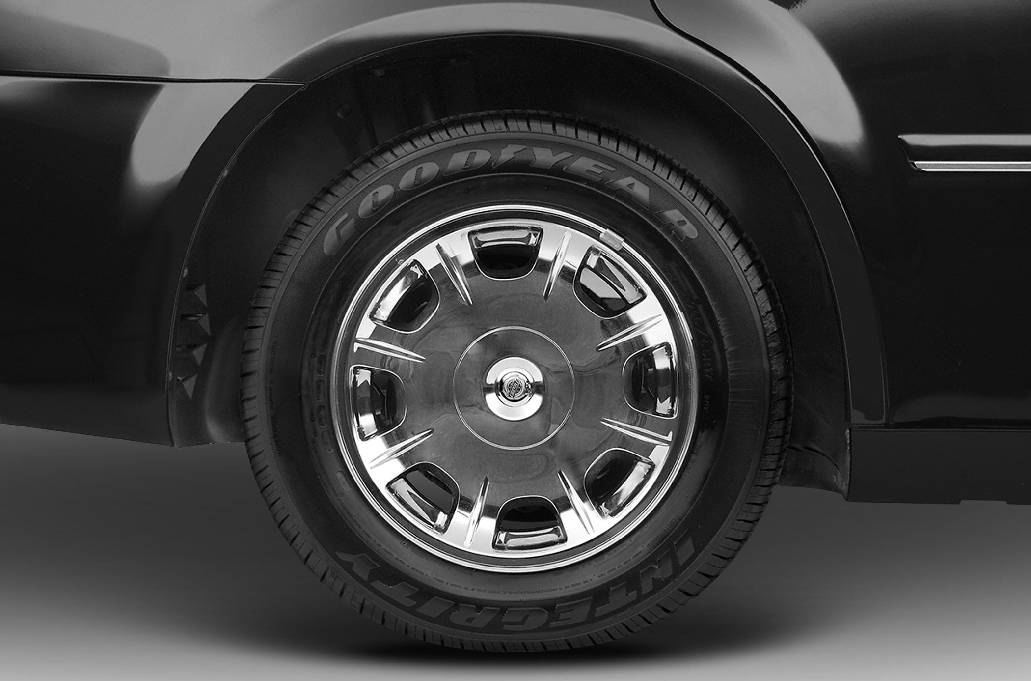 Chrome wheel with Goodyear Integrity tire close-up