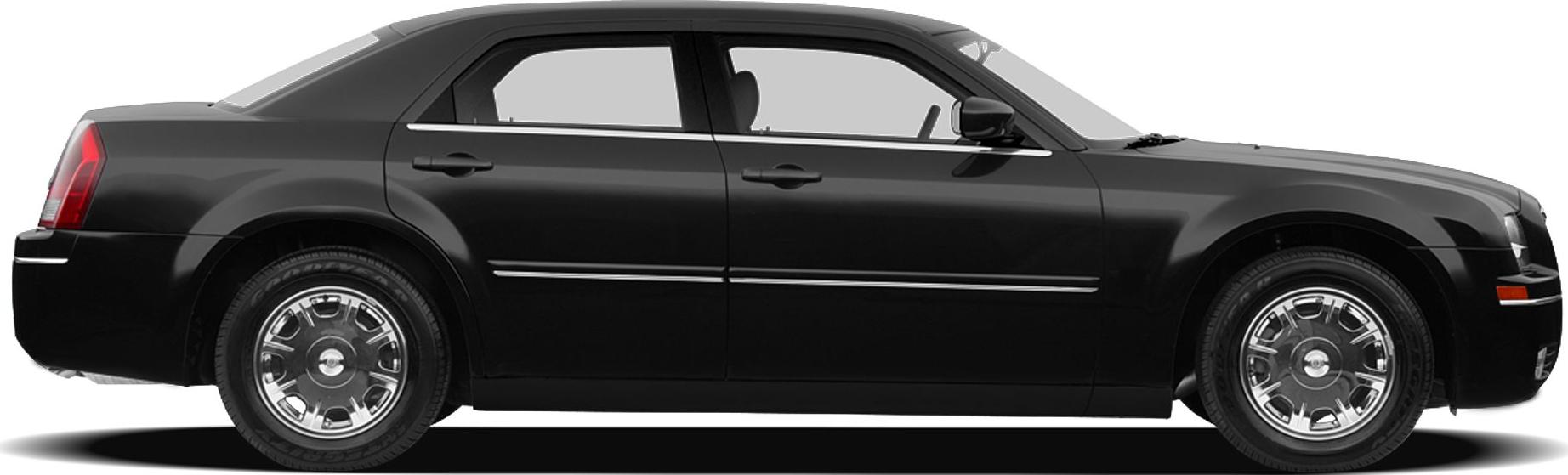 Side view of a sedan with chrome wheels and sleek door panels.
