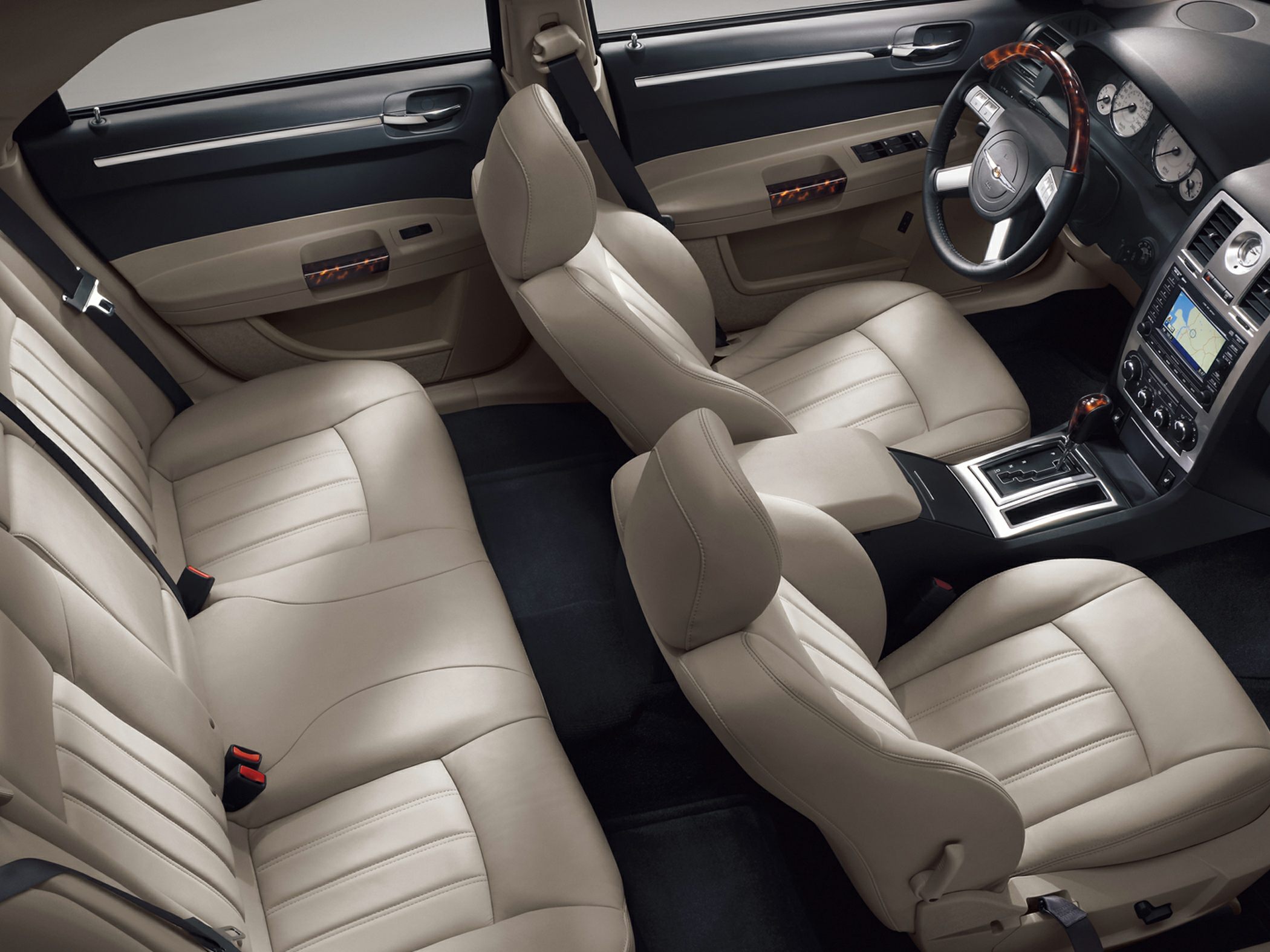 Beige leather seats with wood trim and modern dashboard