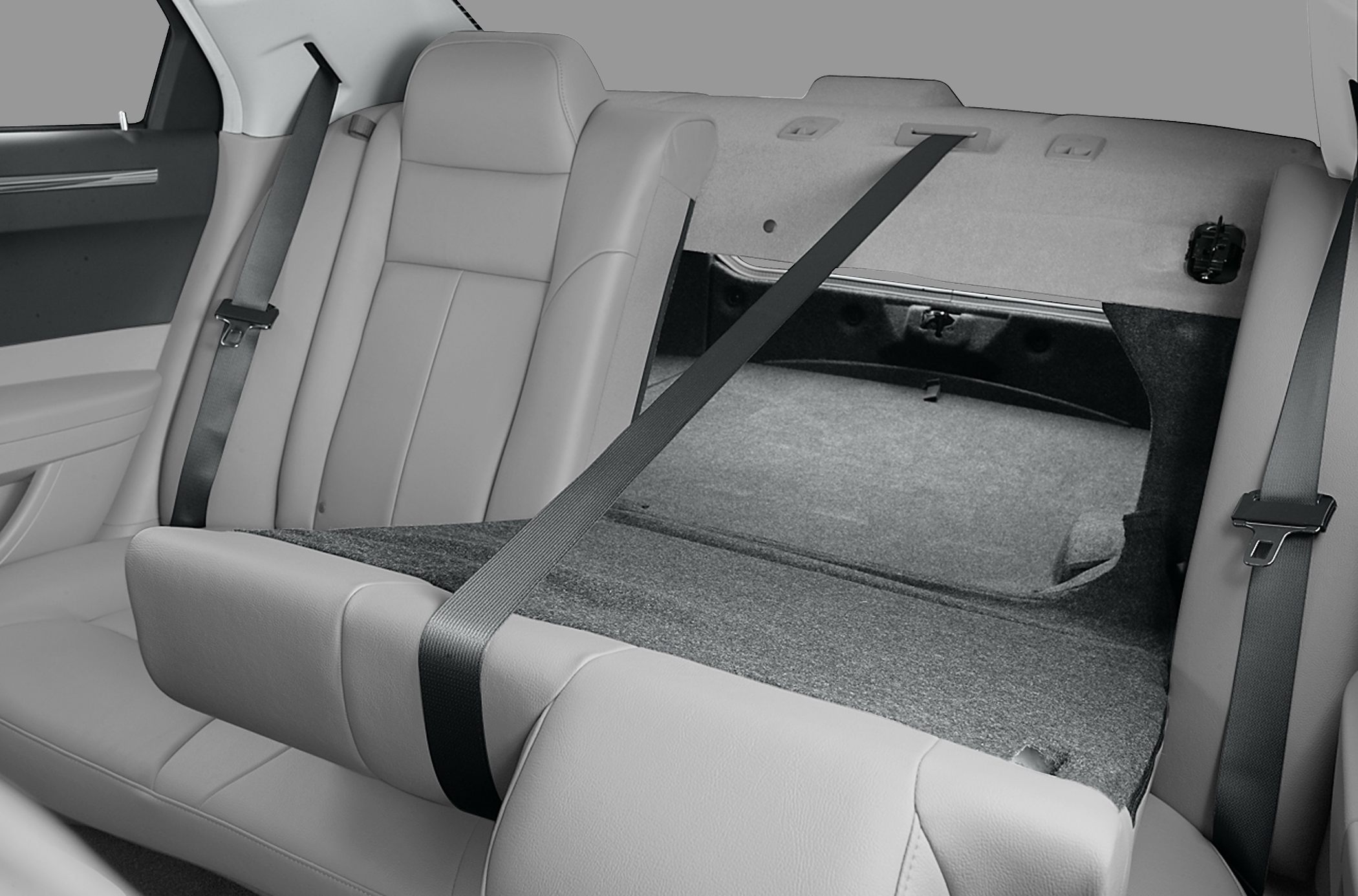 Fold-down rear seat with pass-through opening and integrated seat belts