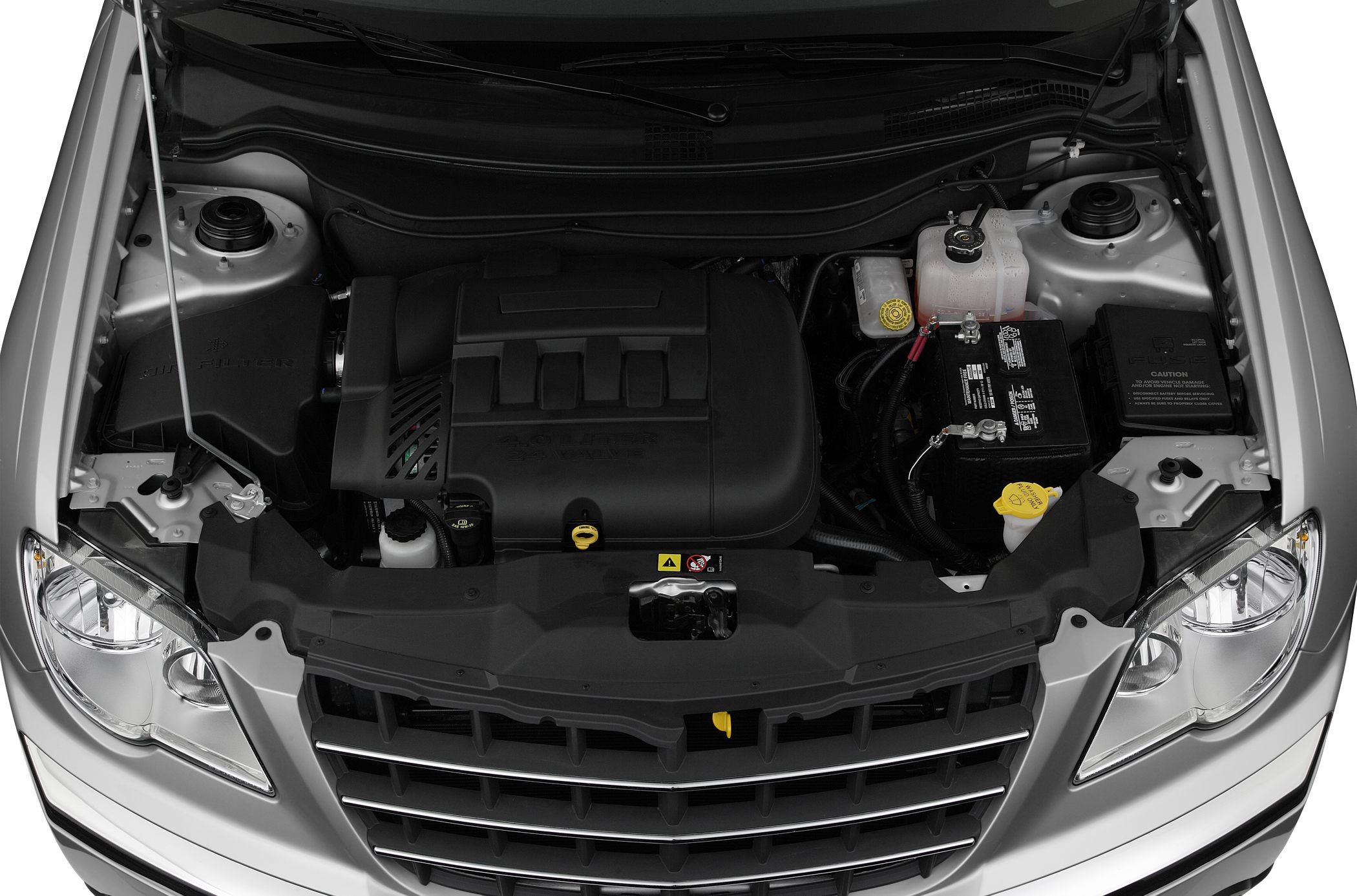 Engine bay with plastic engine cover, battery, and fluid reservoirs