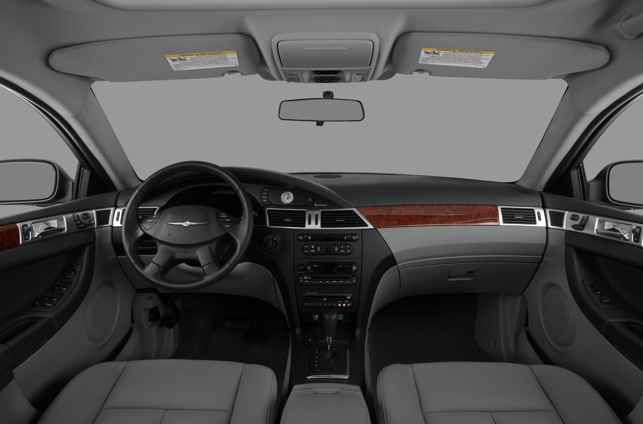 Interior dashboard with wood trim and steering wheel with control buttons