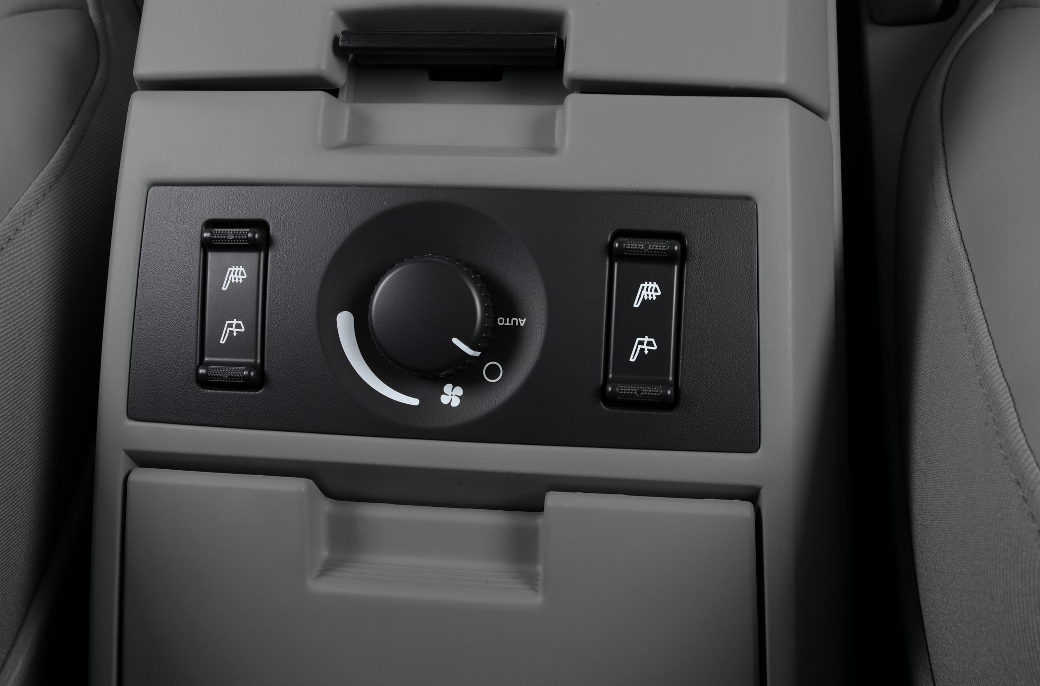 Rear seat climate control panel with fan dial and heated seat switches