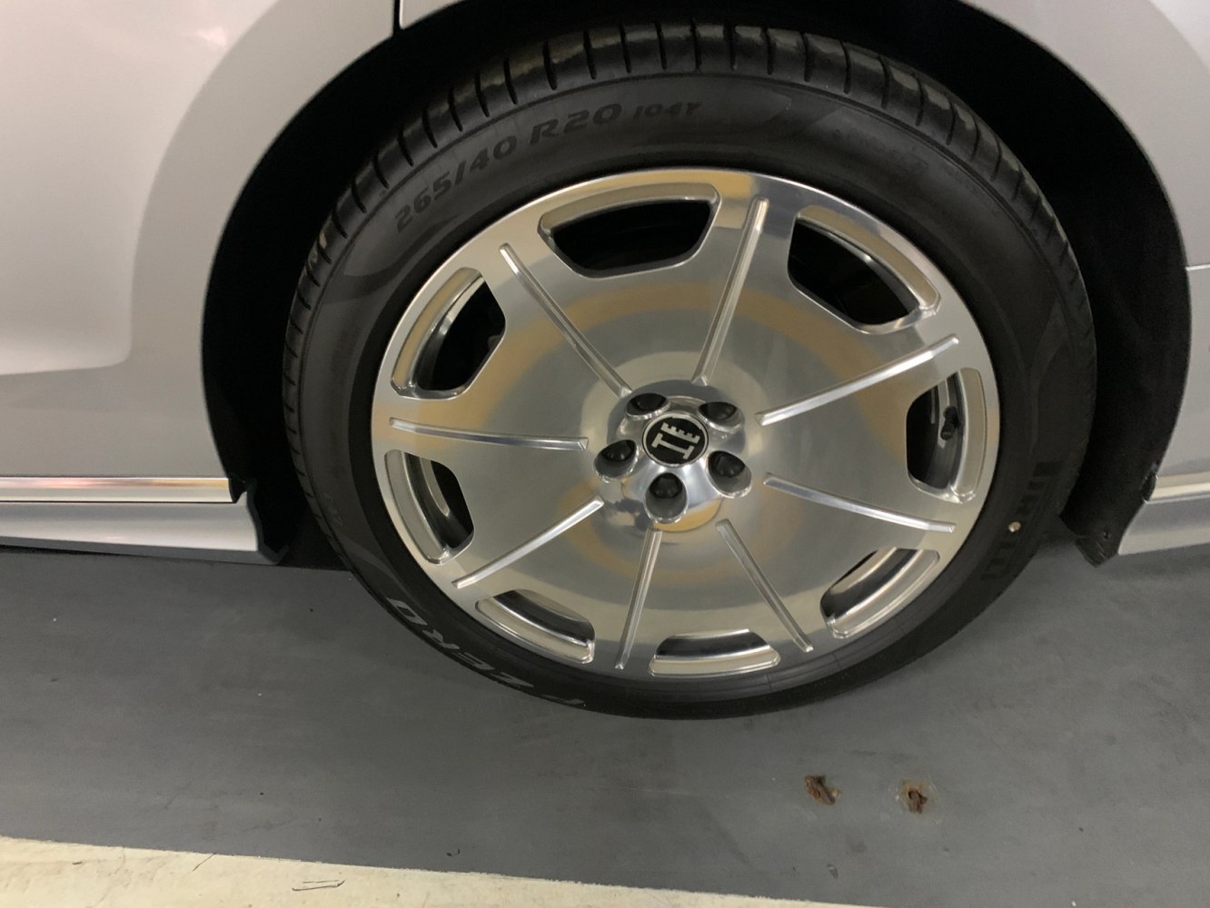 Close-up of a luxury alloy wheel rim with tire specifications