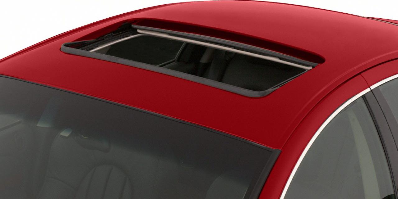 Open sunroof on a sedan roof with glass panel and surrounding trim