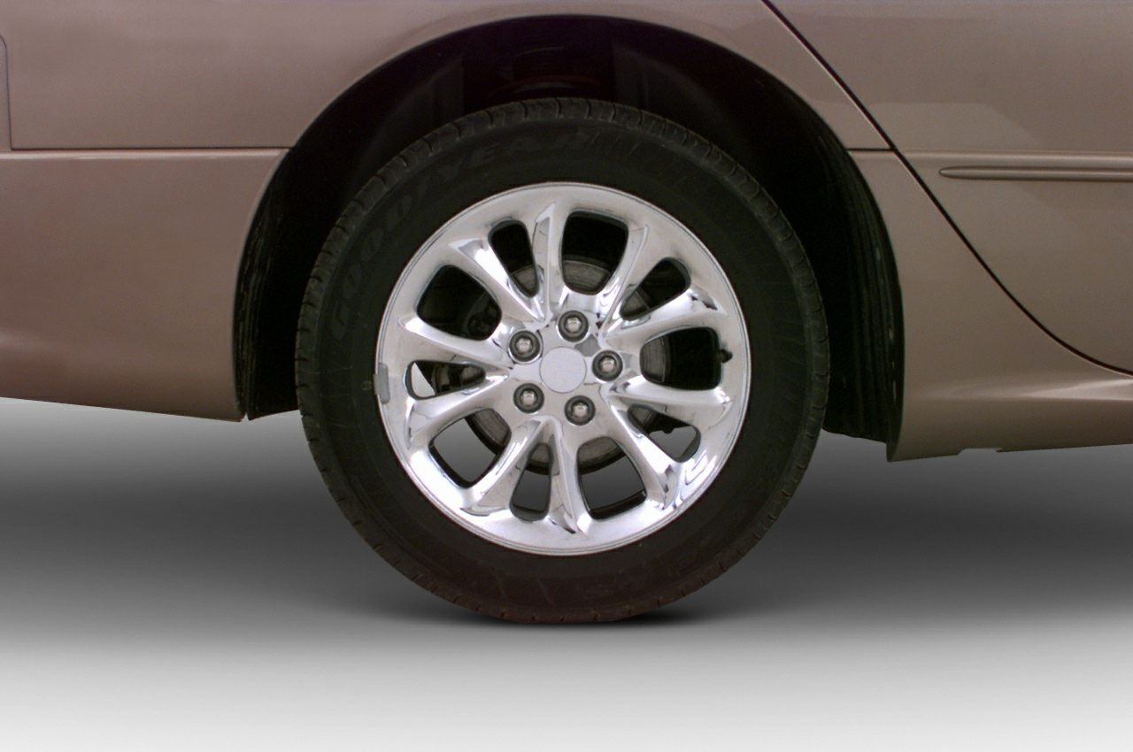 Polished alloy wheel with multi-spoke design and Goodyear tire close-up