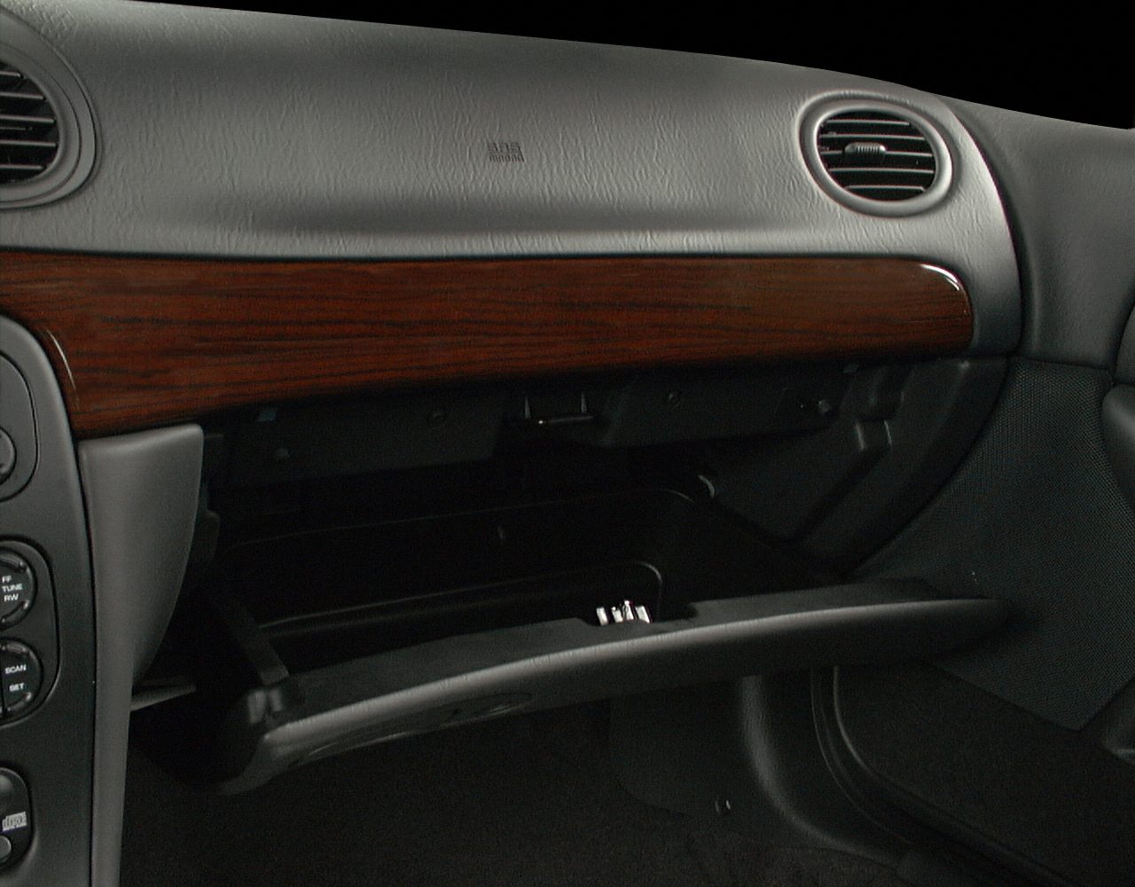 Dashboard with wood trim and open glove compartment