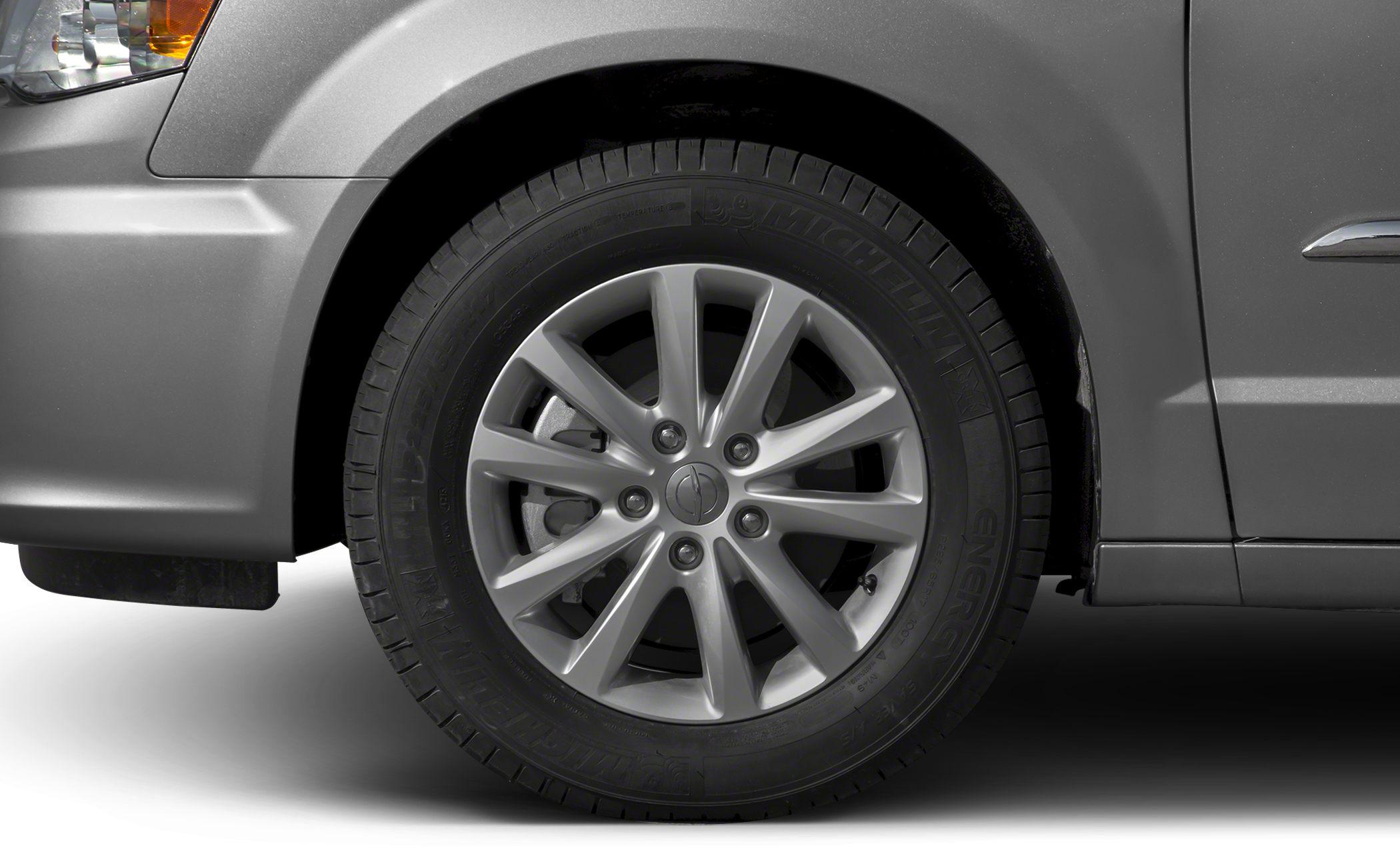 Alloy wheel with Michelin tire on a minivan front wheel area