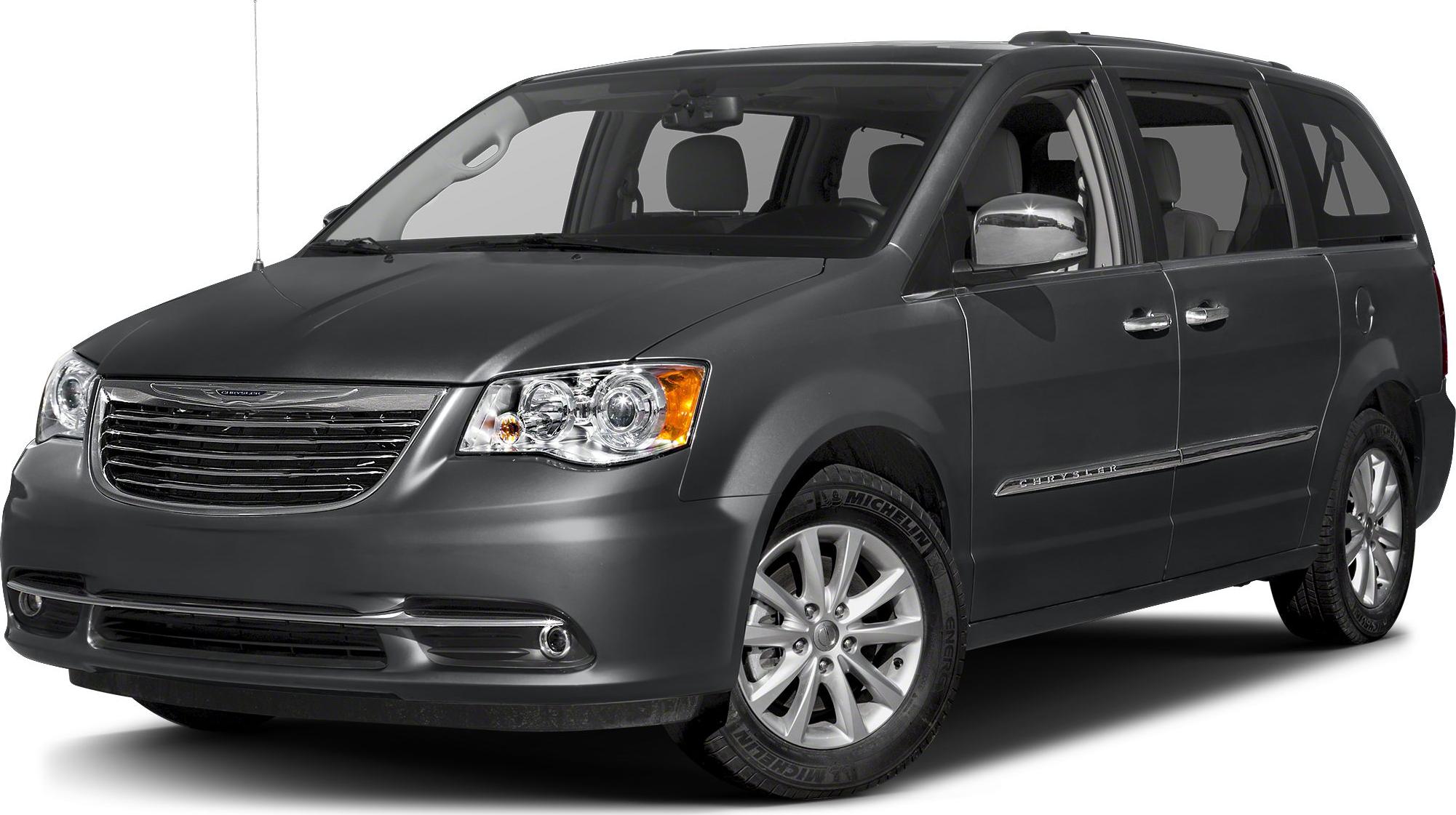 Front side view of a minivan with alloy wheels and visible side doors
