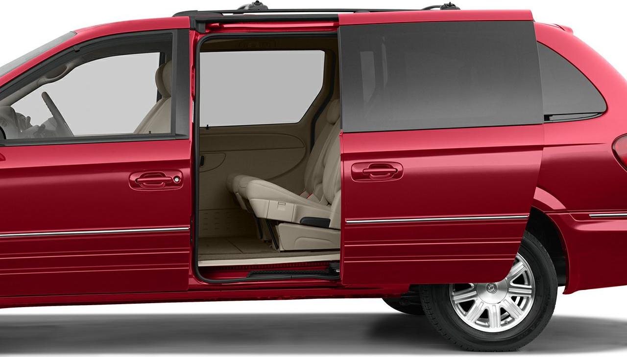 Sliding side door open with beige second-row seats and spacious interior.