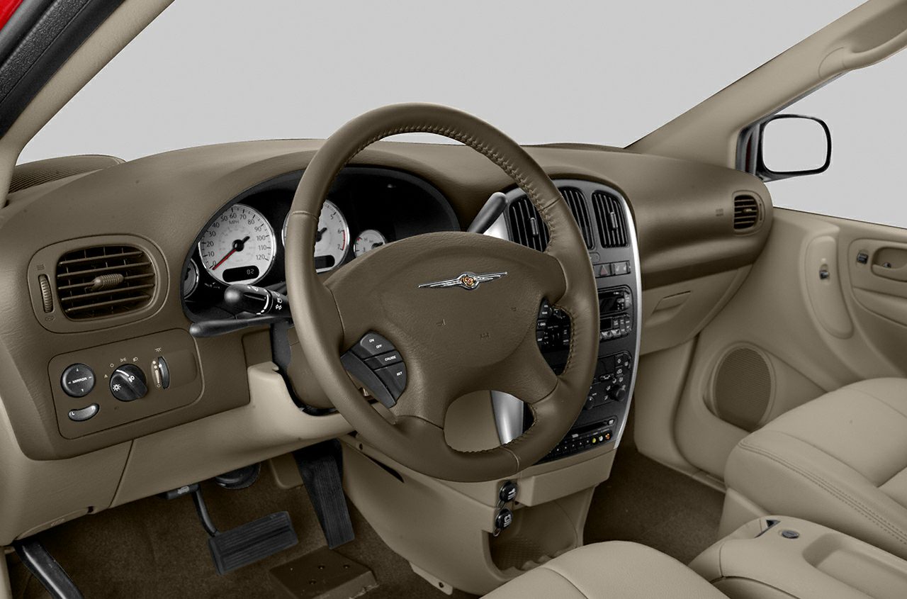 Steering wheel and dashboard with beige interior and control buttons