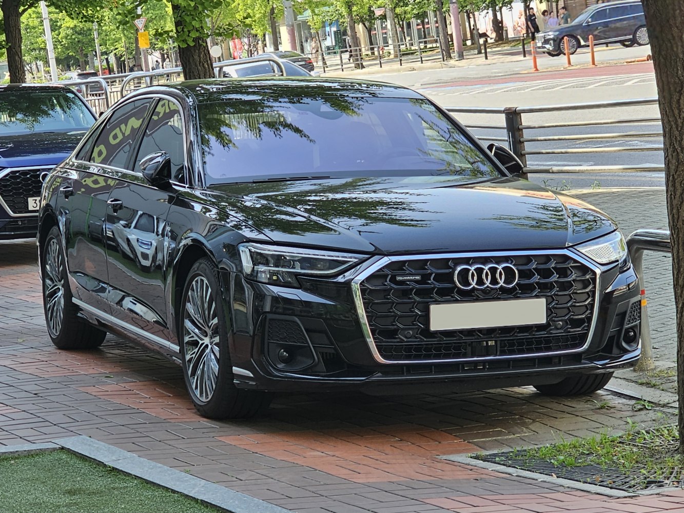 Luxury sedan with a front hexagonal grille and LED headlights