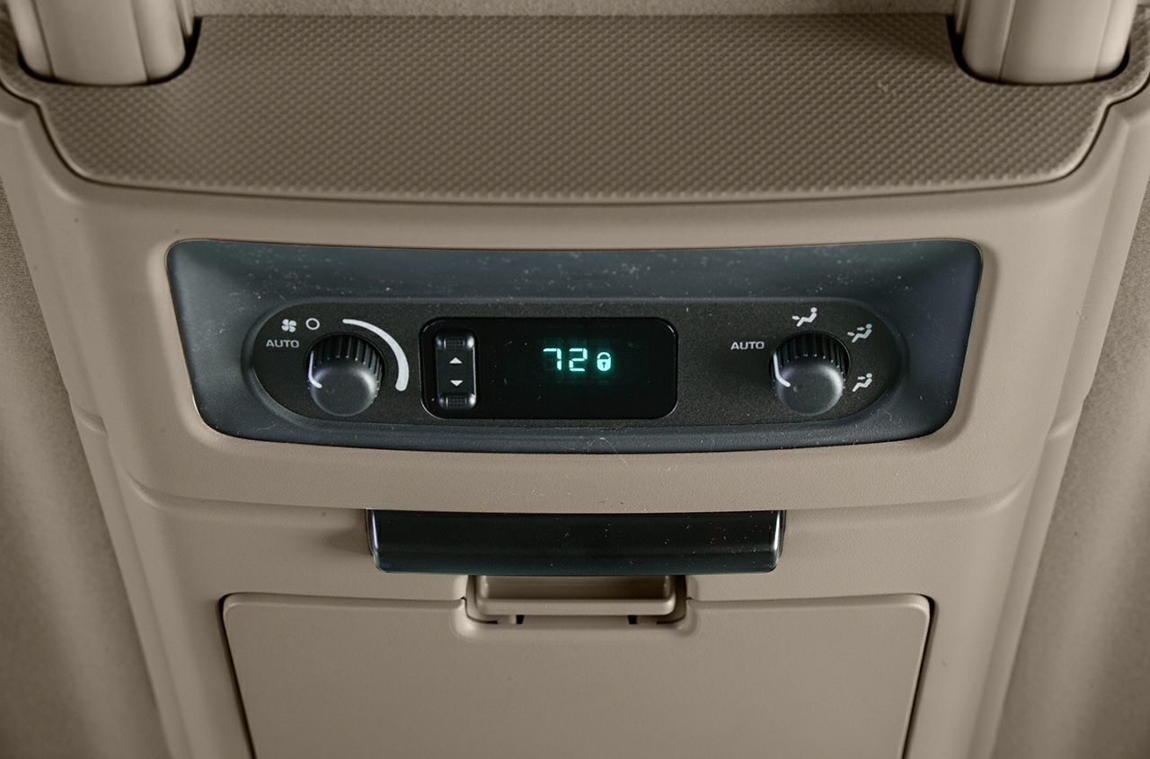Rear climate control panel with dual knobs and digital temperature display
