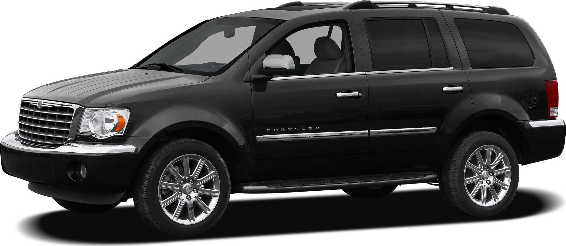 Large black SUV with chrome grille, wheels, and side accents