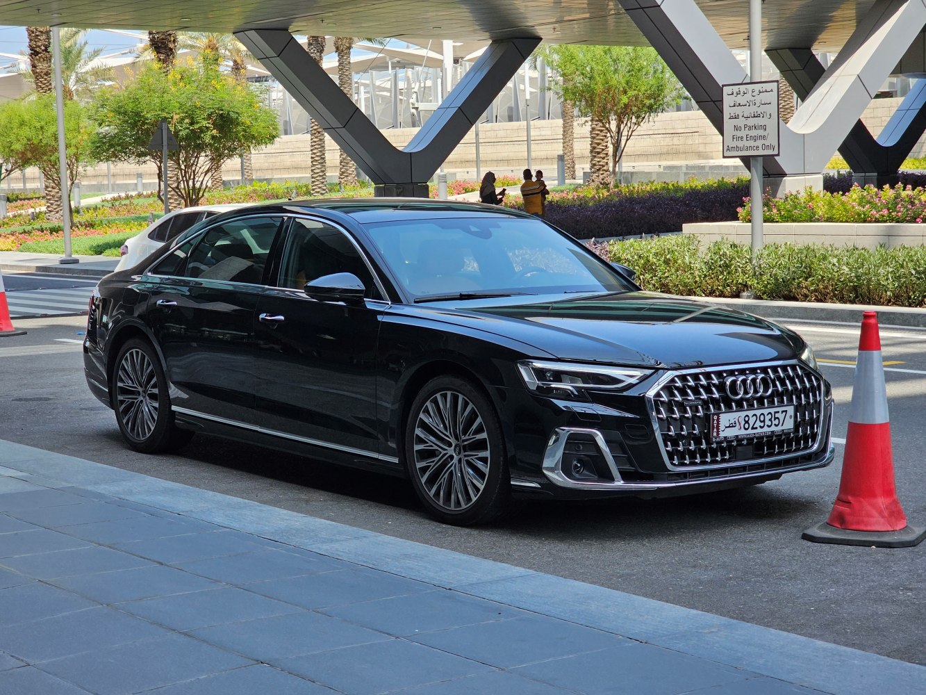 Large chrome front grille and multi-spoke alloy wheels on luxury sedan