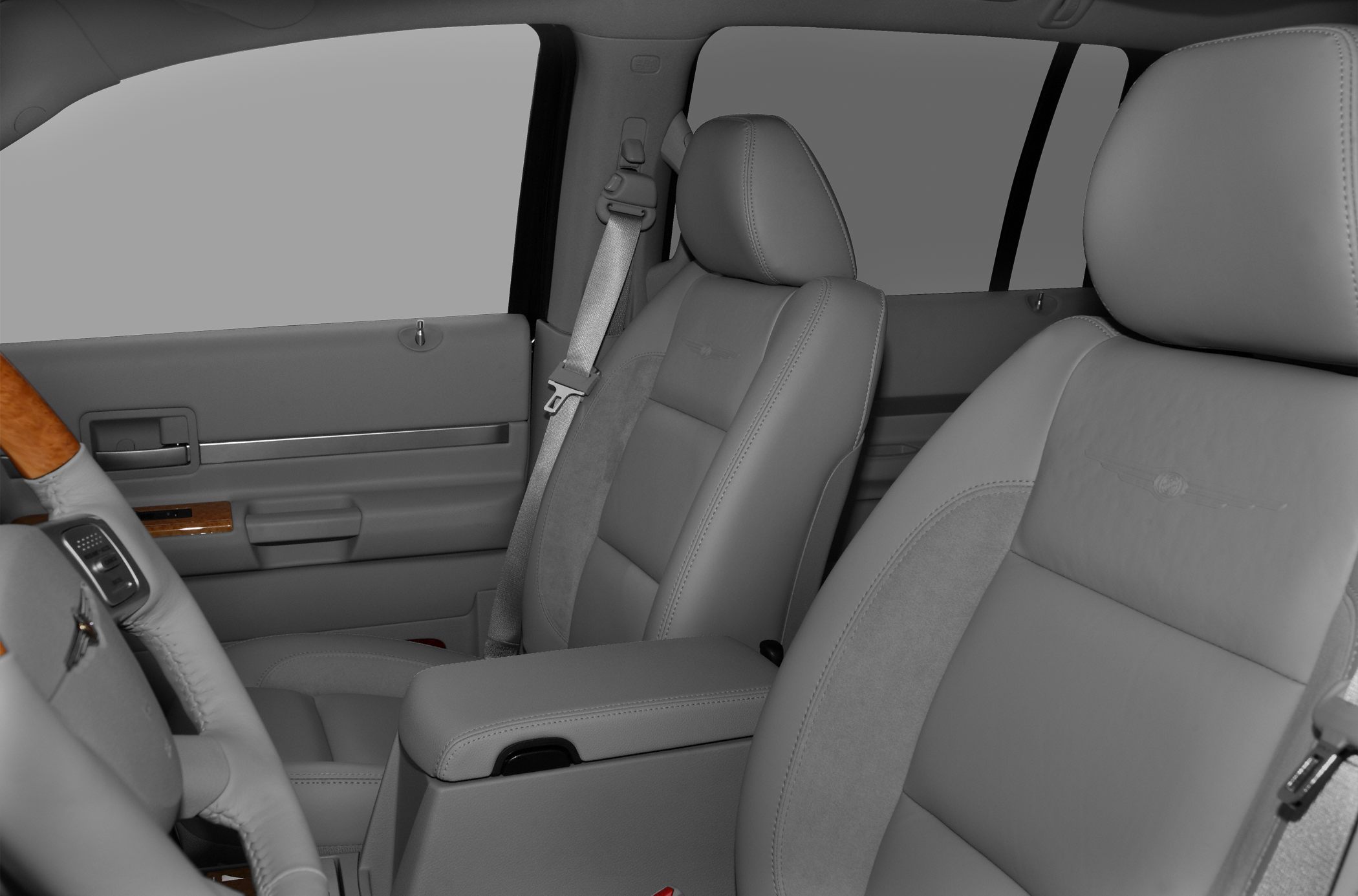 Leather seats with embroidered logo and wood trim accents