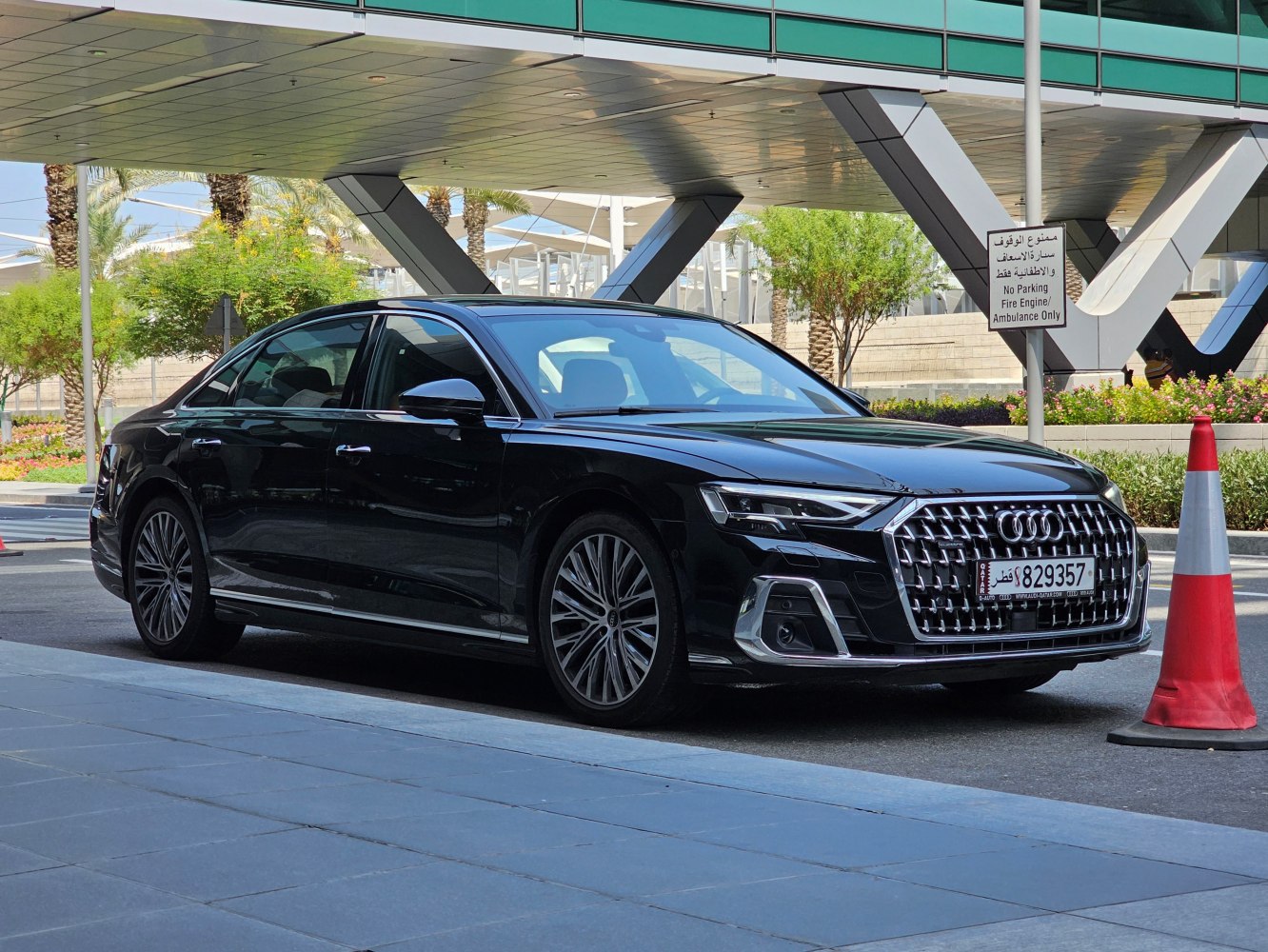 Front side view of a luxury sedan with distinctive grille and alloy wheels