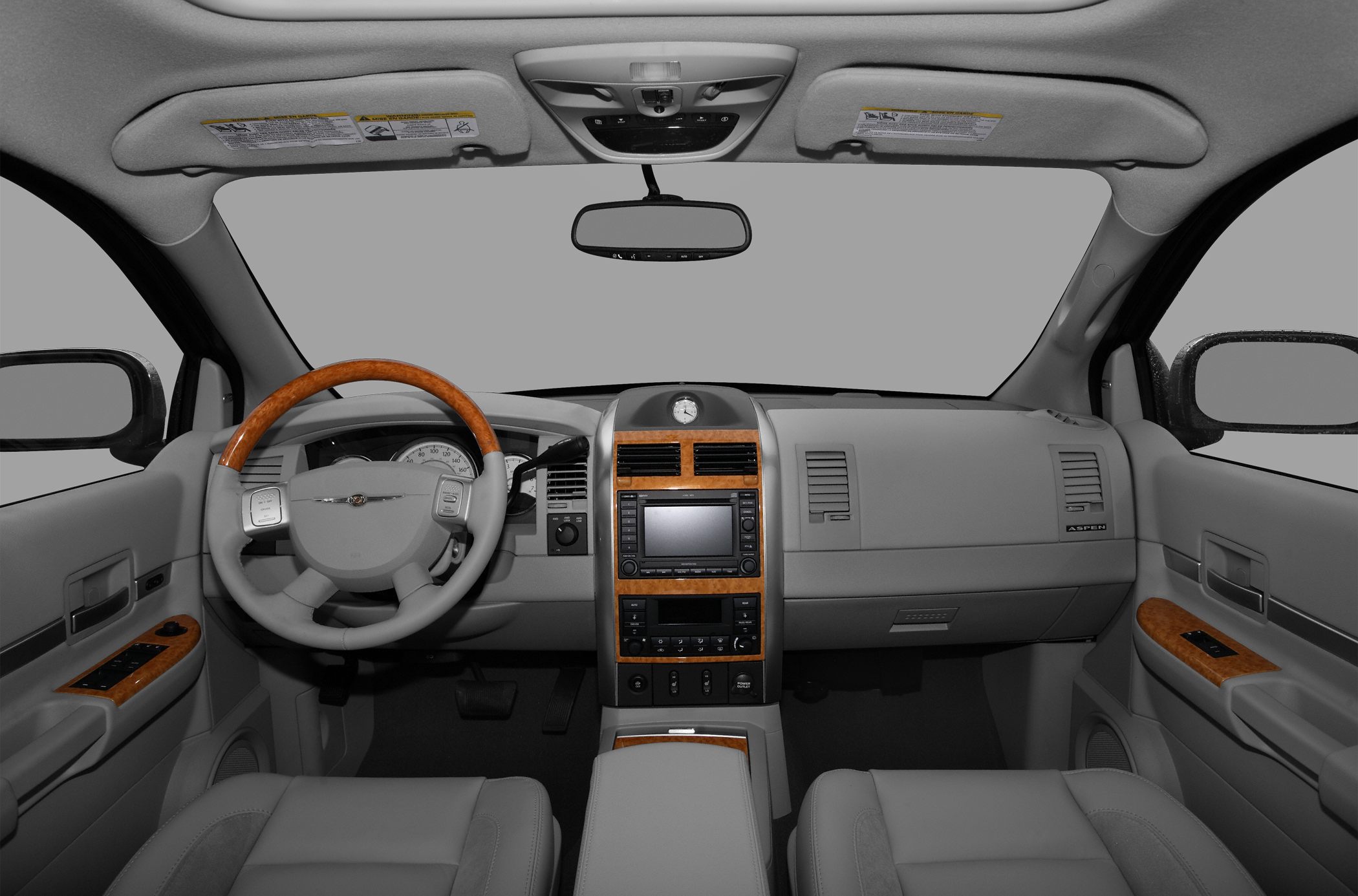 Dashboard and wood trim accents with center console and steering wheel