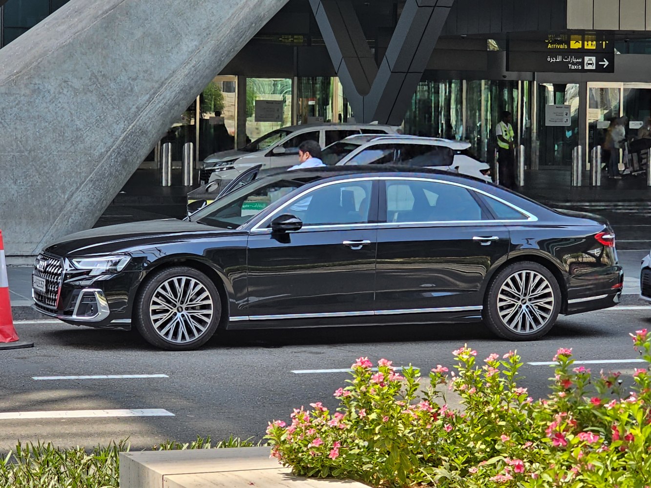 Sleek luxury sedan with distinctive alloy wheels and elongated side profile