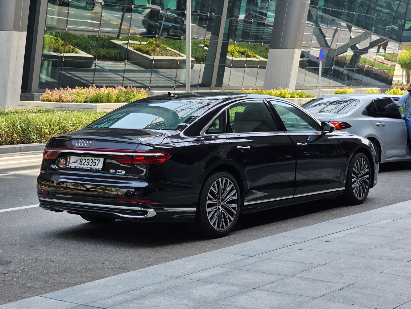 Rear and side view of luxury sedan with LED tail lights and elegant profile