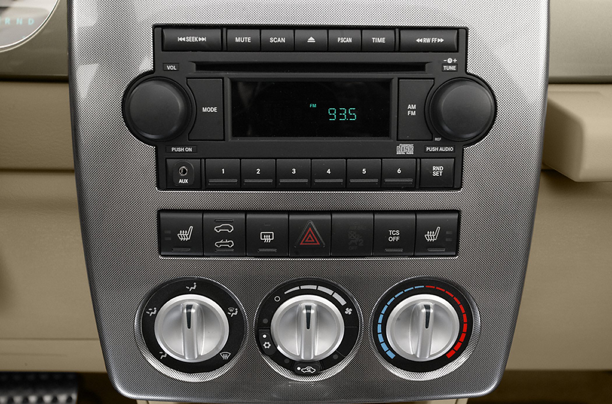 Car radio and climate control panel with knobs and buttons