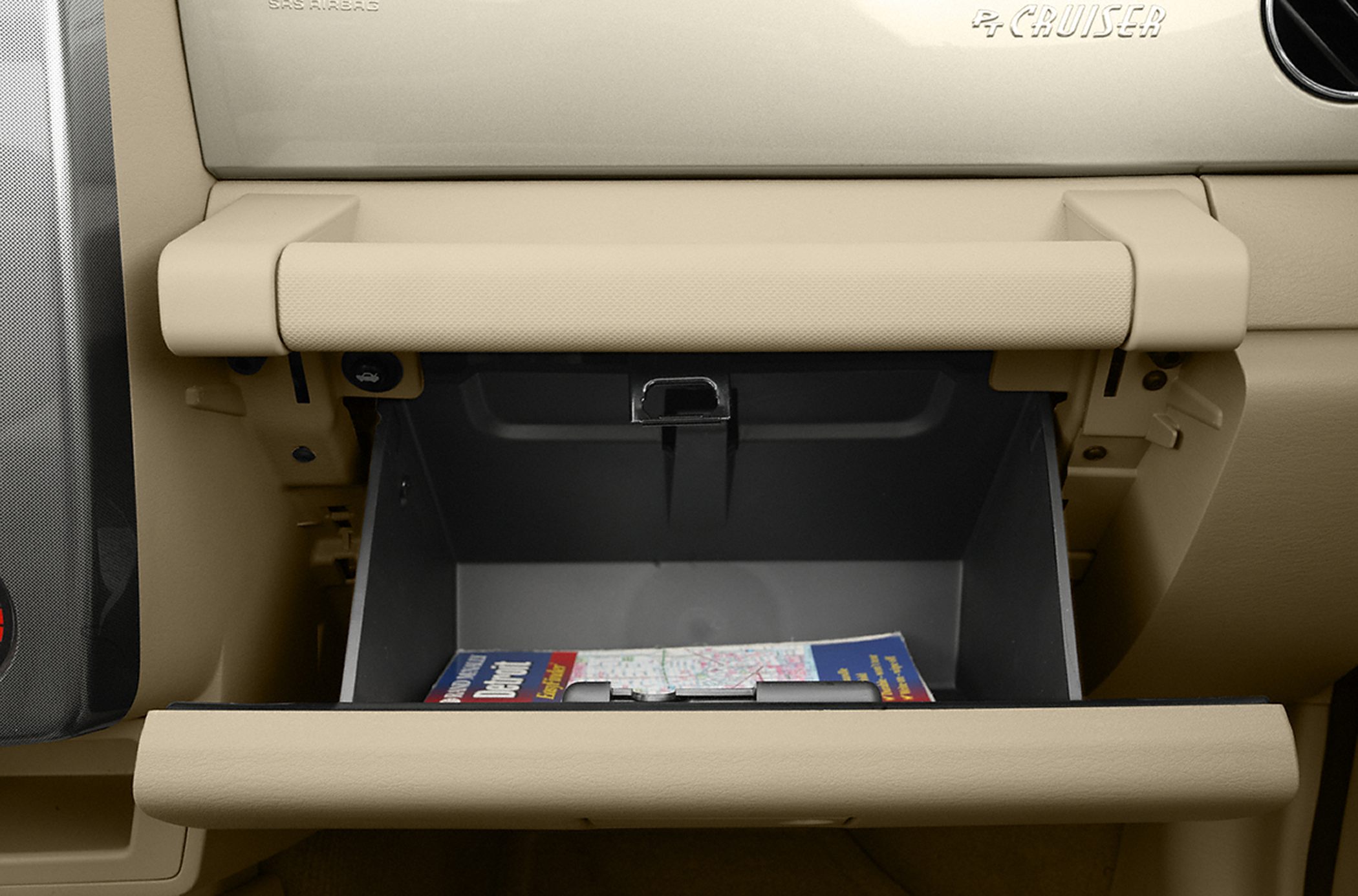 Open glovebox with beige dashboard interior