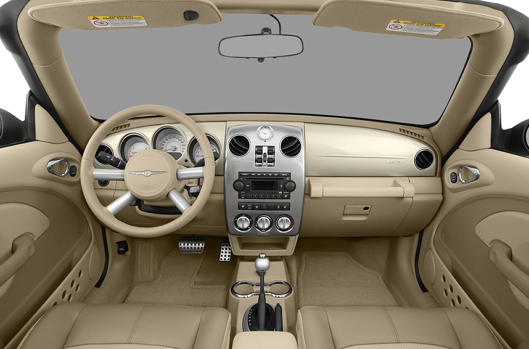 Beige convertible interior with dashboard and steering wheel