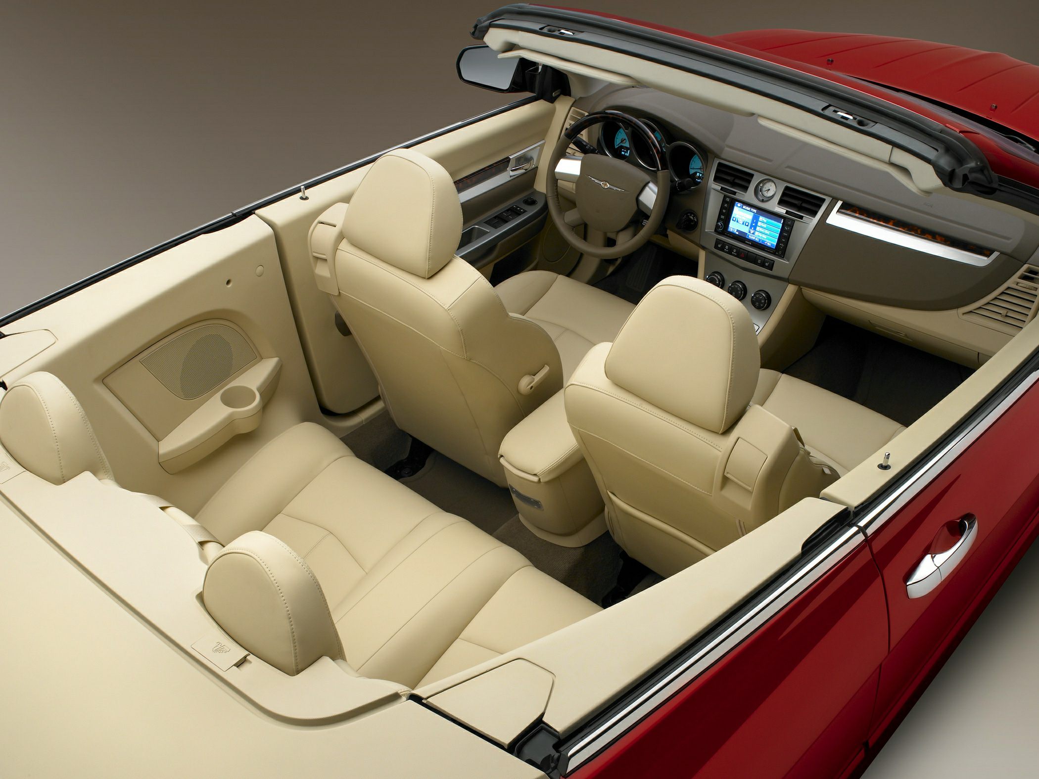 Convertible interior with beige leather seats and detailed dashboard