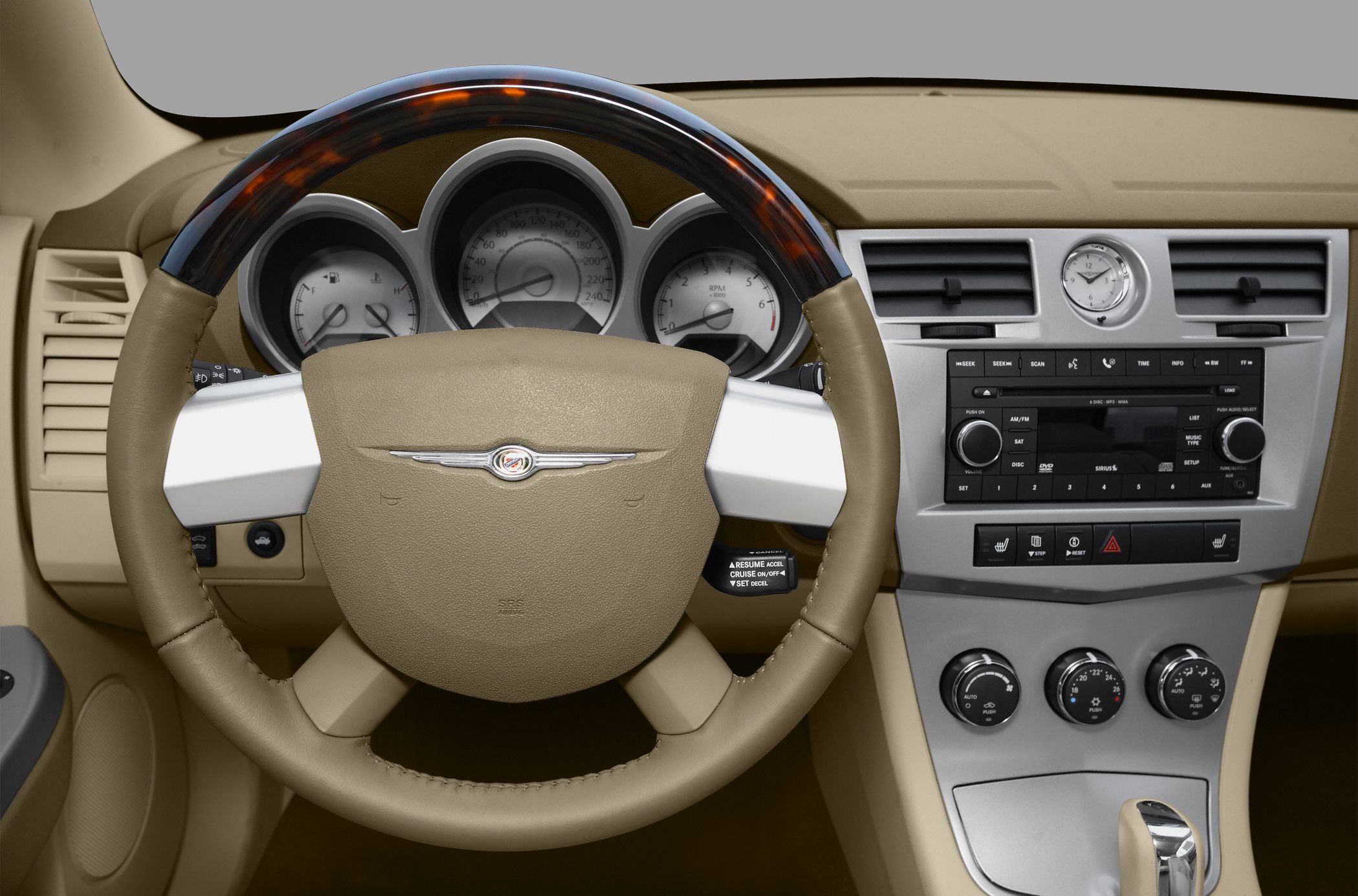 Wood trim steering wheel and classic dashboard with analog clock