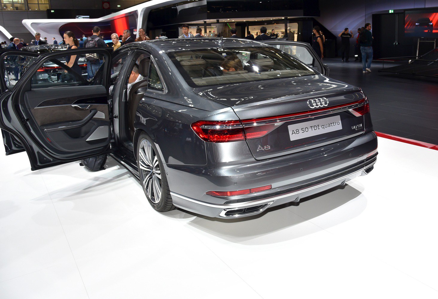 Rear view with open doors and illuminated tail lights