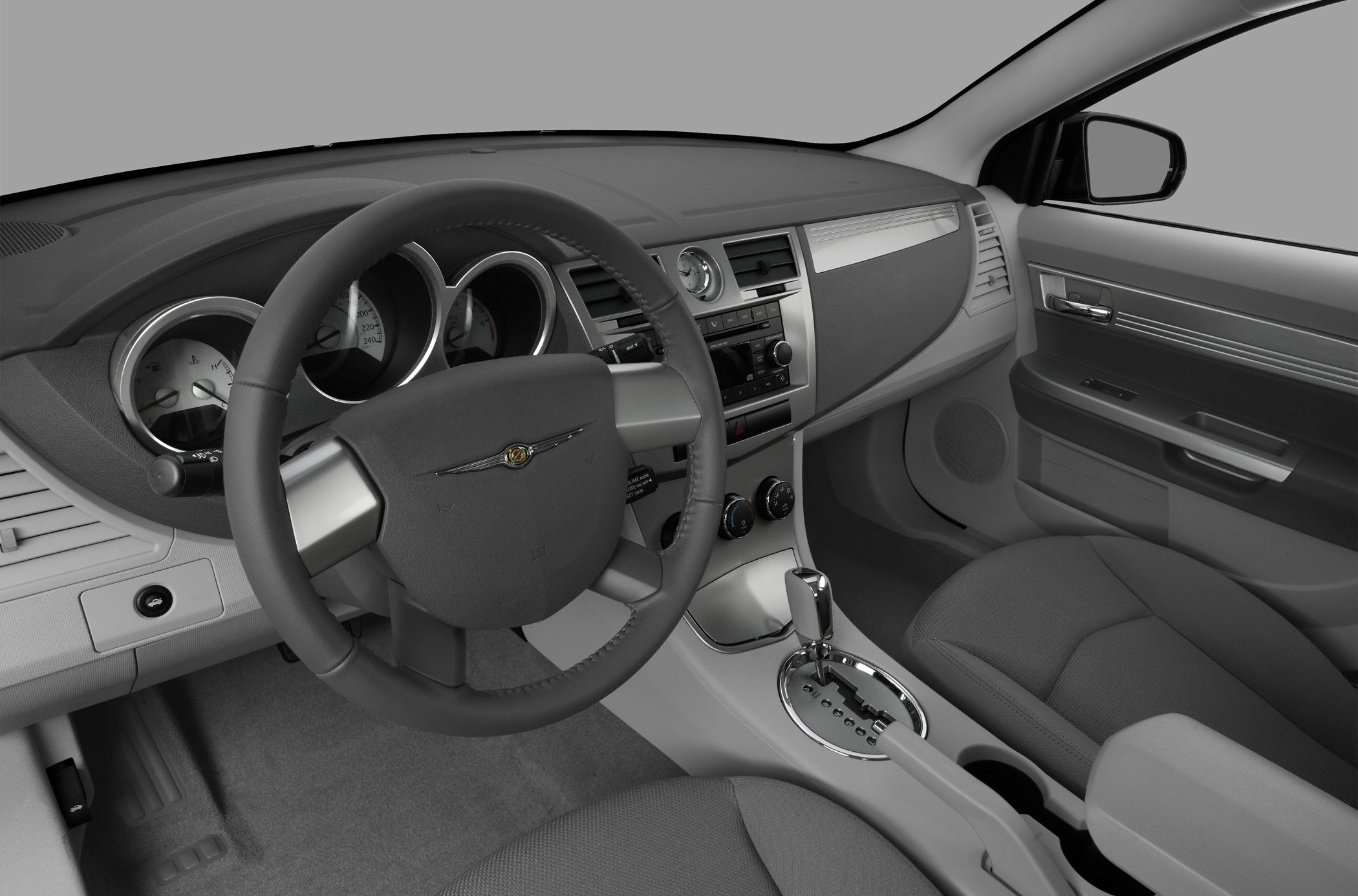 Dashboard with gauges, center console, steering wheel, and gear shift.