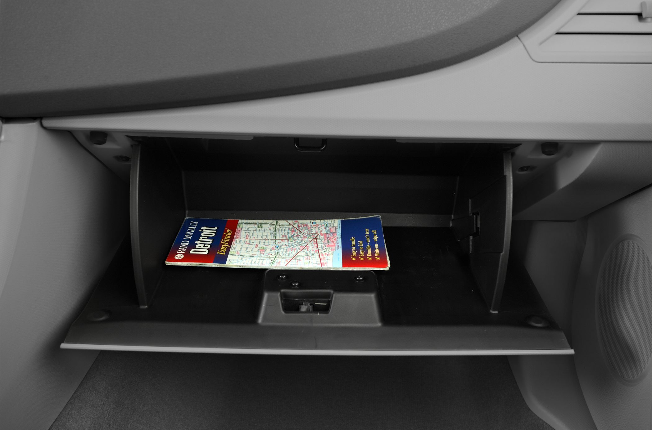 Open glove compartment with a map inside
