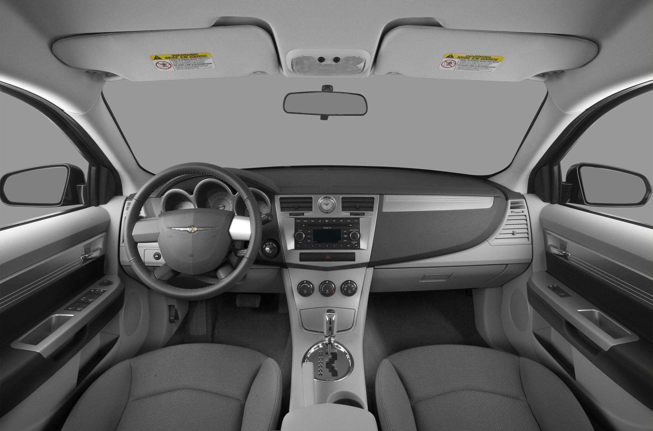 Dashboard and steering wheel with center console and front seats
