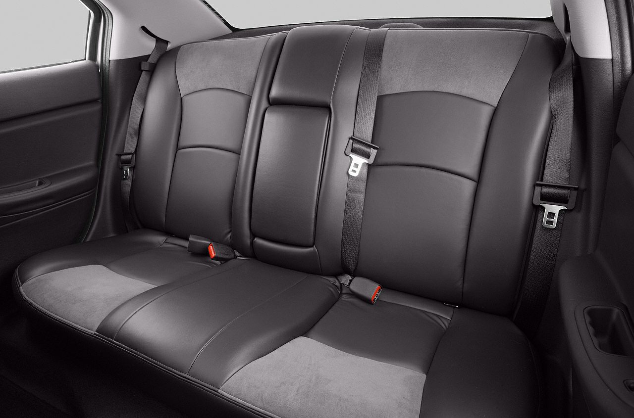 Black leather rear seat with seat belts and upholstery details