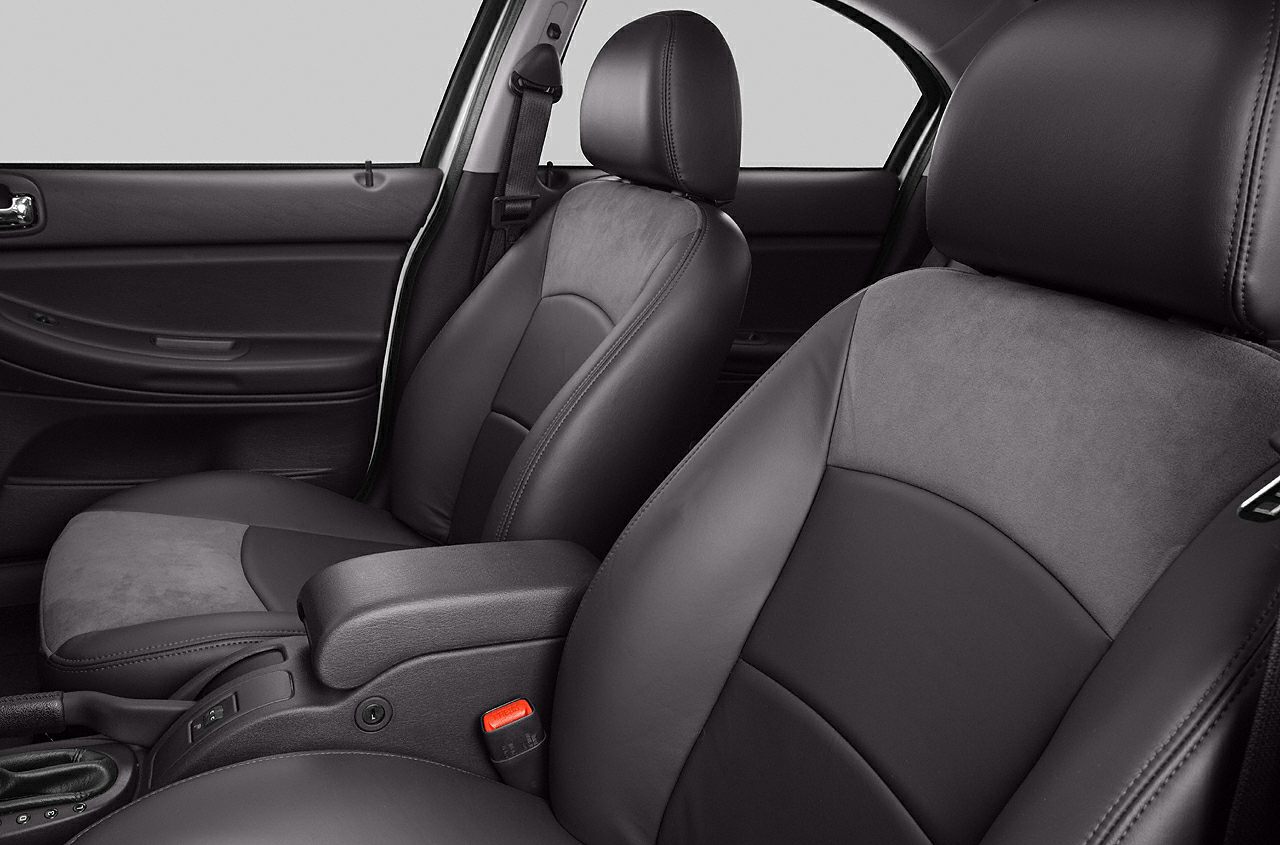 Leather front seats with center armrest and seatbelt