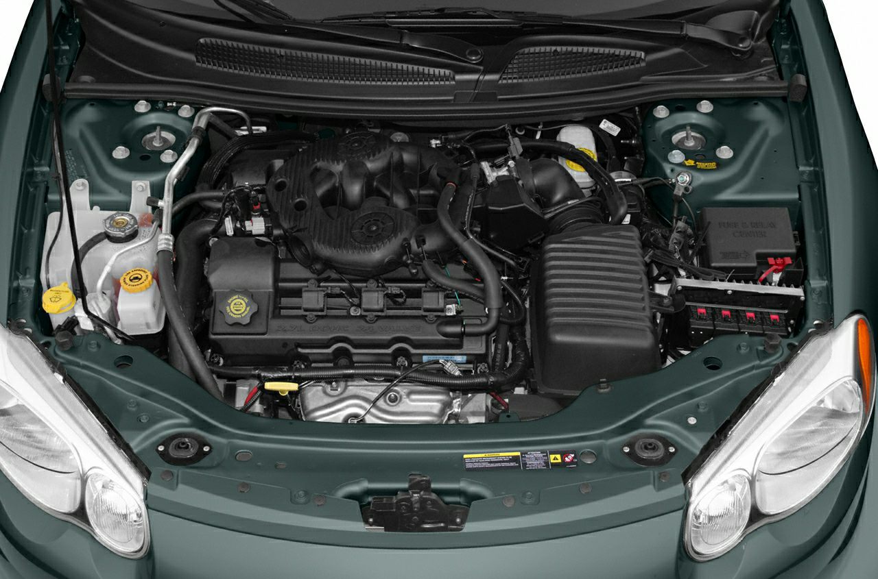 Open engine bay with 2.4L inline-four engine and associated components