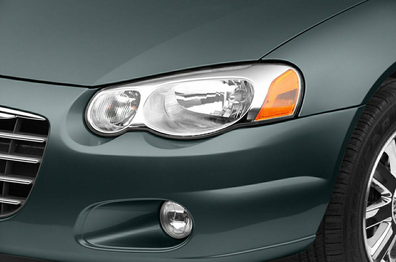 Front headlight, grille, fog light, and fender close-up