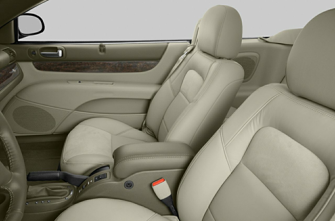 Close-up of beige leather car seats and inner door panel
