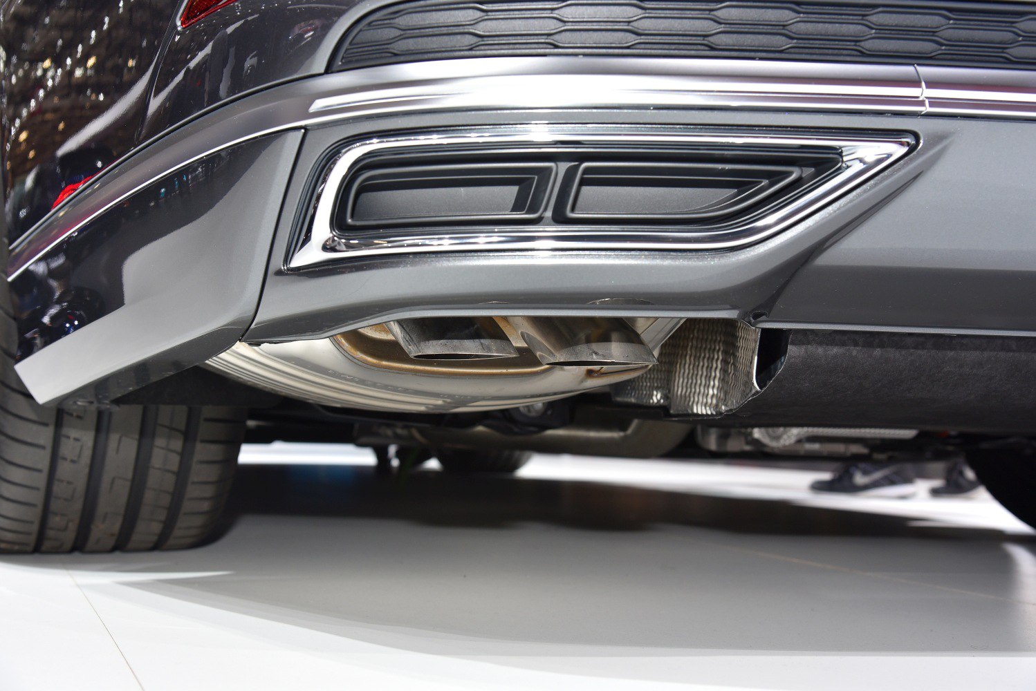 Close-up of rear dual exhaust and tire undercarriage