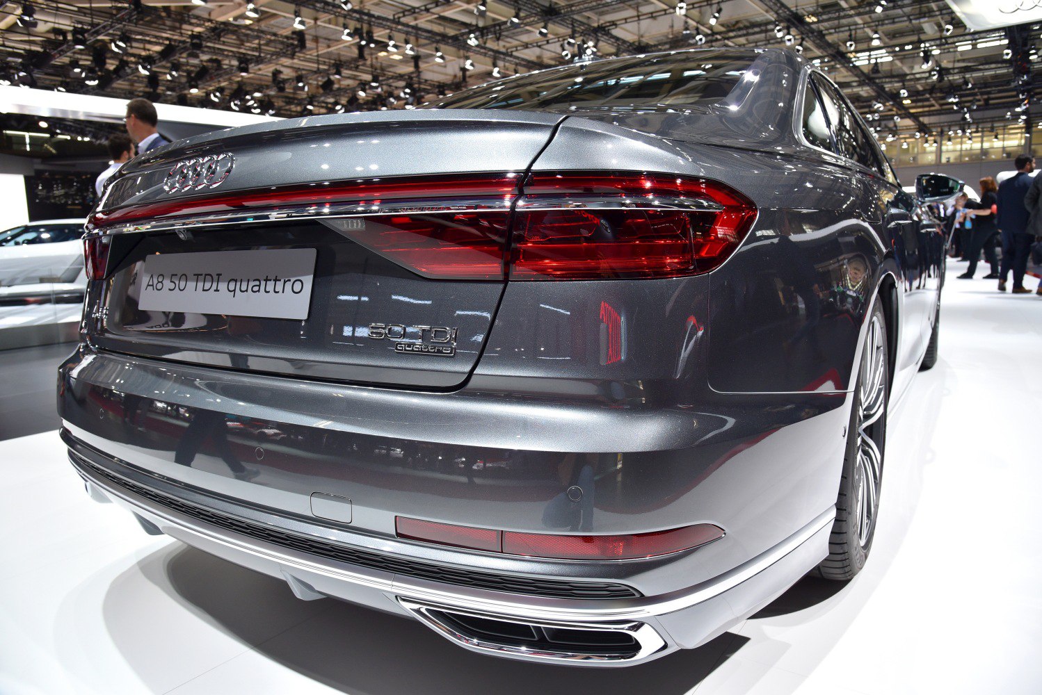 Rear end with distinctive taillights, quattro badge, and dual exhaust tips