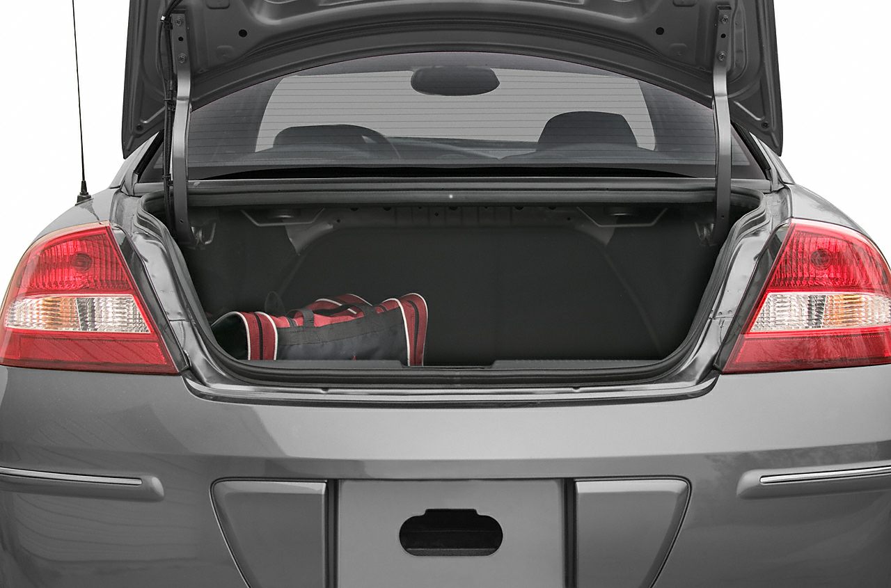 Open trunk with visible storage space and rear taillights