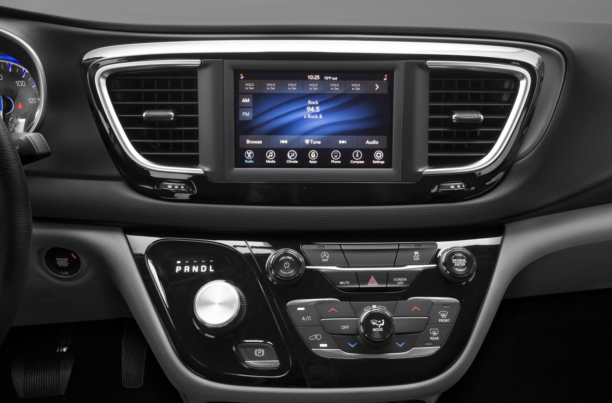 Center console with touchscreen infotainment and rotary gear selector.