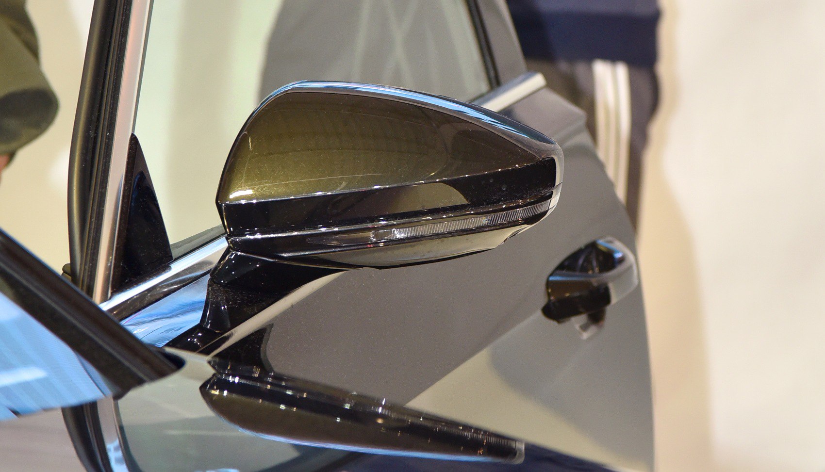 Close-up of side mirror with integrated LED turn signal light