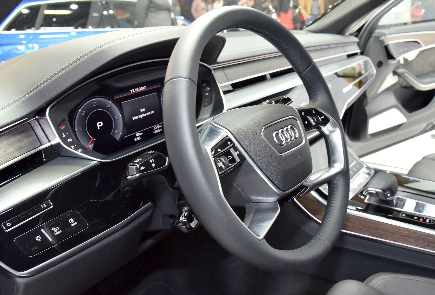 Digital dashboard and leather-wrapped steering wheel with control buttons