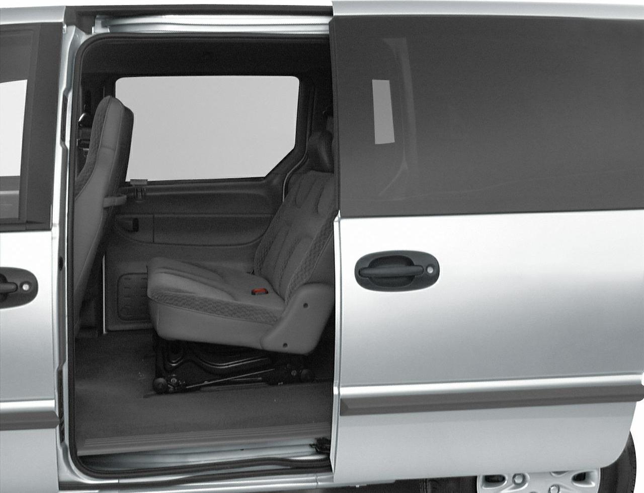Sliding door open showing minivan interior seats and door handle