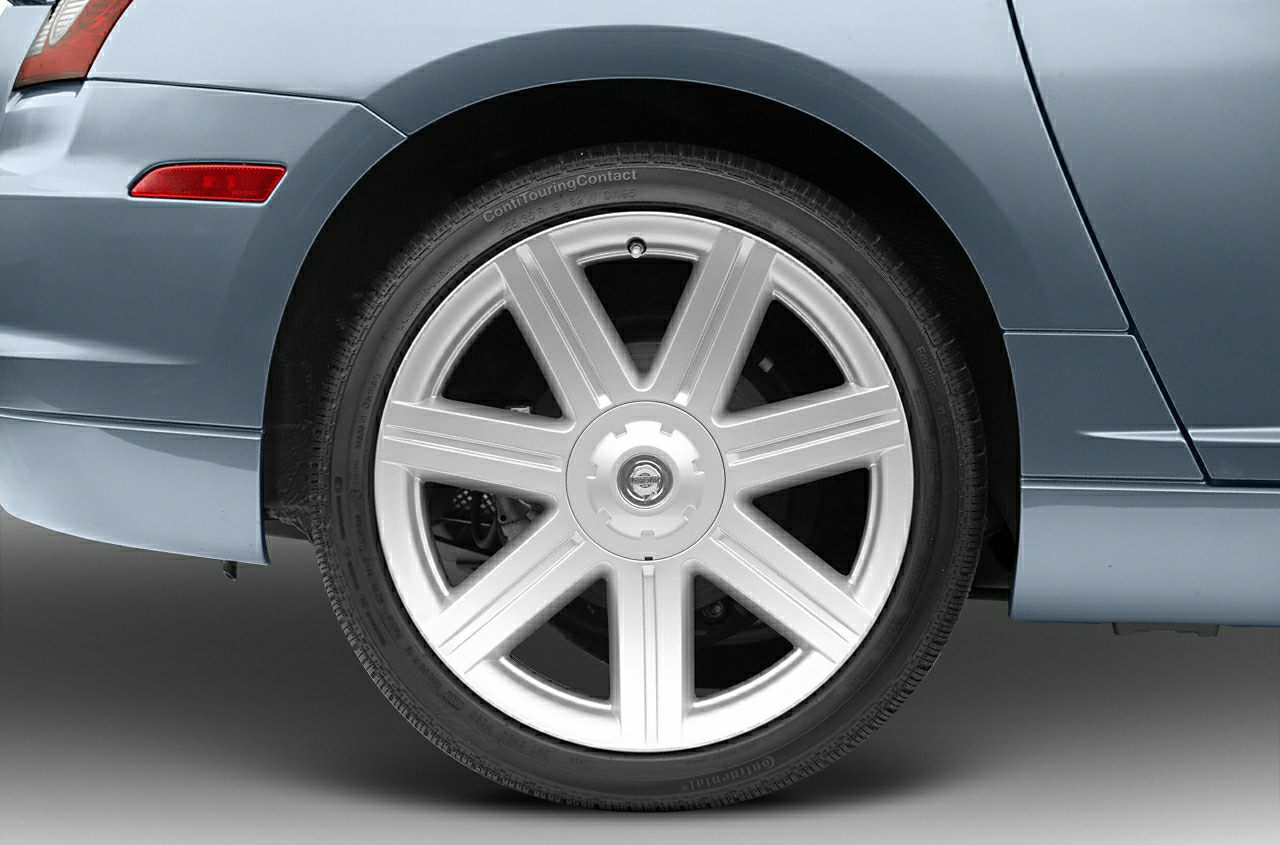 Close-up of a 7-spoke alloy wheel and tire from a sporty convertible.